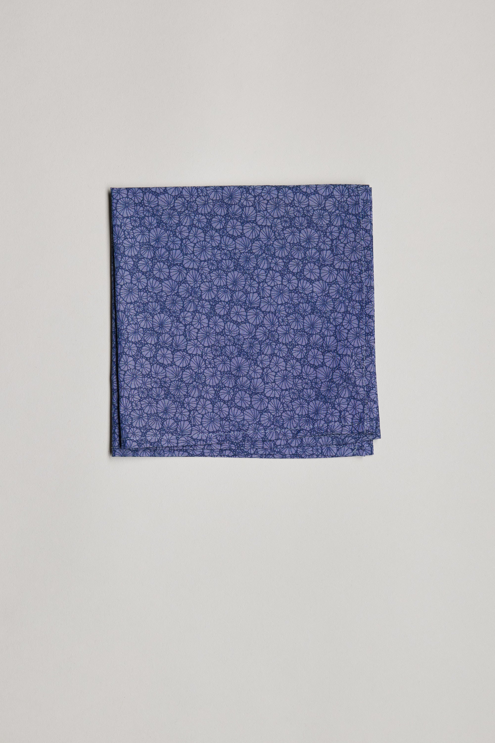 The Seashell Bloom Liberty PS by Liberty, made from Tana Lawn cotton with a detailed floral Liberty Print, is neatly folded and displayed on a simple, light background.