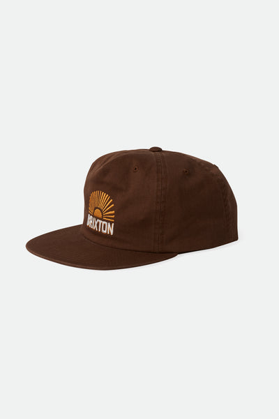 The Brixton Sol HP Snapback Cap is a brown cap with a yellow sunrise graphic and BRIXTON embroidered on the front. It features an adjustable snapback for comfort.