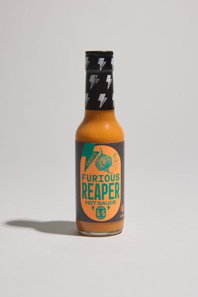 A bottle of Culley's Furious Reaper Hot Sauce features an orange label with a black cap, lightning bolt graphics, a Carolina Reaper chili image, and a 5/5 heat rating. The bottle stands upright on a plain background.