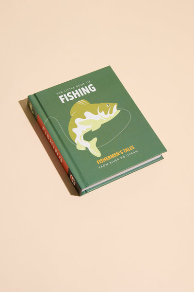 The Little Book of Fishing by Other, a green hardcover featuring a fish and fishing line illustration, rests on a beige surface—an ideal pick for anglers wanting to connect with nature.