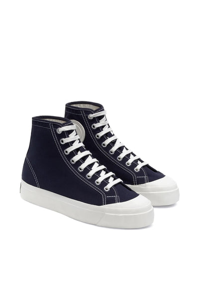 A pair of Superga Campinato Basket high-top sneakers by Superga in navy blue canvas with white stitching and laces, featuring white vulcanized rubber outsoles, are displayed side by side on a plain white background.