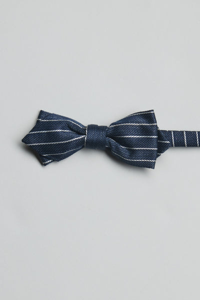 The Parisian Lanark Stripe Bow Tie by Parisian features navy and thin white diagonal stripes, handcrafted in New Zealand and set against a light gray background—an elegant wedding accessory.