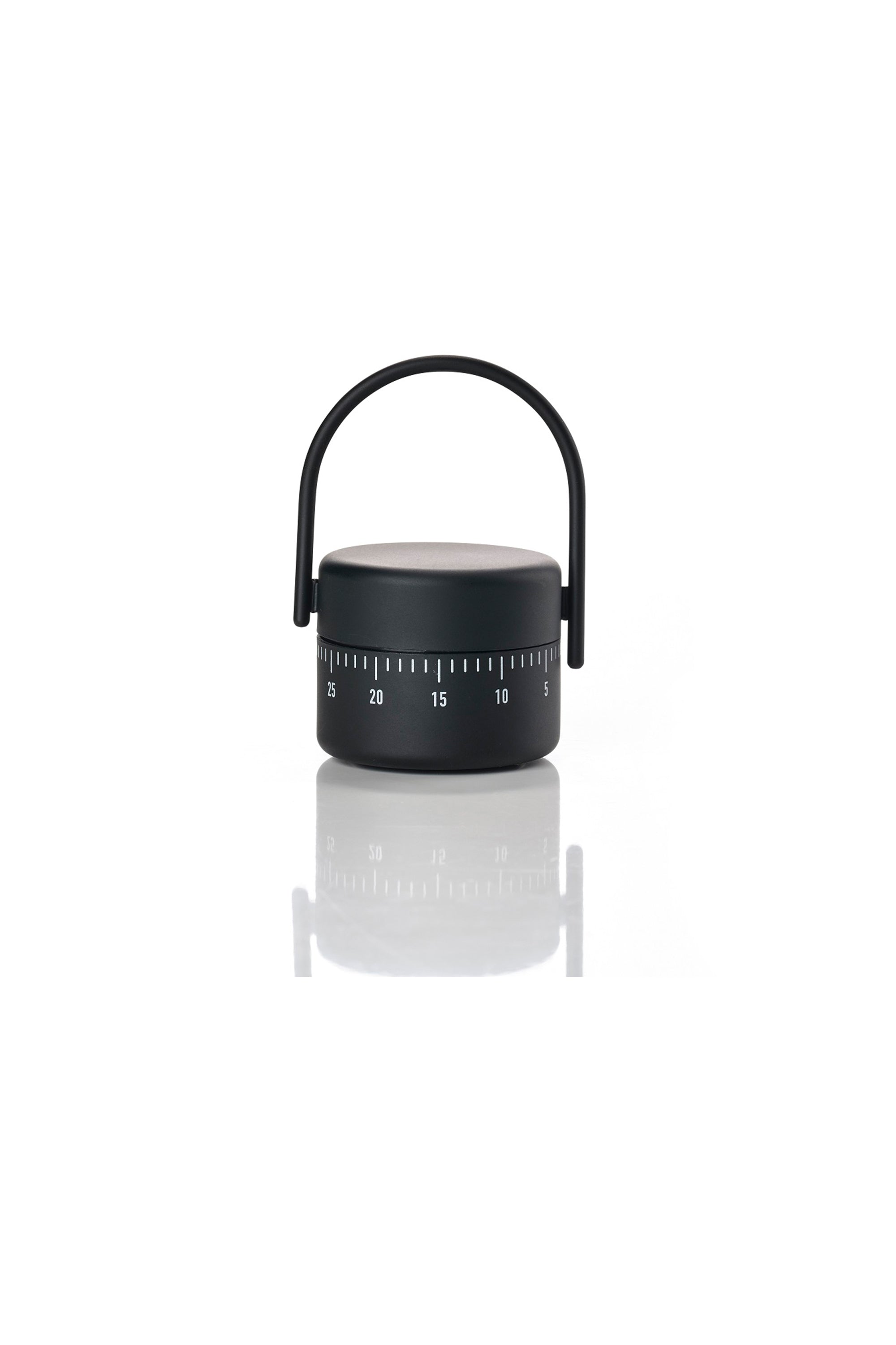 The Other Zone Kitchen Timer, in black with a rounded handle, features numbers in increments of five and a soft-touch surface. Its minimalist, modern design adds style to any kitchen as it sits on a reflective white surface.