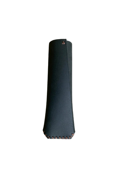 The Ironclad Pan Snug by Other is a black leather sheath with brown stitching along the curved bottom, crafted from genuine New Zealand leather skillet handle sleeve material and shown against a white background.