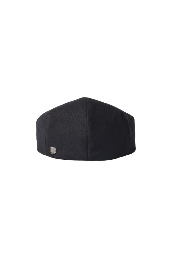 The Brixton Hooligan Snap Cheesecutter by Brixton is a black herringbone cotton chef hat with a slightly rounded top and a small metallic logo on the lower left, shown against a white background.