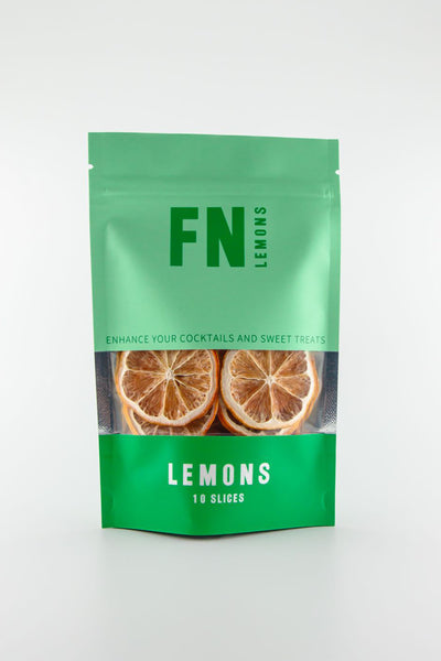 An upright F N Lemons - Lemons 10 Slice Pouch by F N Lemons, in green and turquoise packaging labeled "Enhance your cocktails and sweet treats," contains 10 dried lemon slices, perfect for use as a premium garnish.