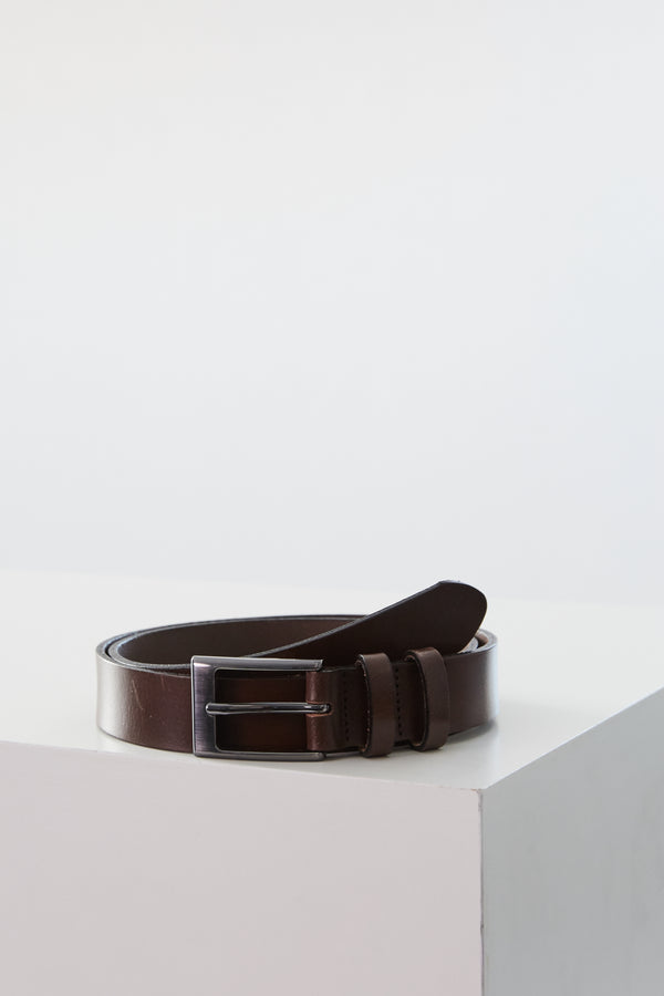 The Barkers Frances Leather Belt, in dark brown with a square buckle, is coiled neatly on a white surface against a plain light background.
