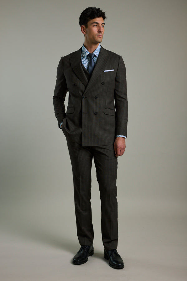 Man in Barkers Radcliffe Stripe Double Breasted Suit Jacket, blue shirt, and tie on plain background.
