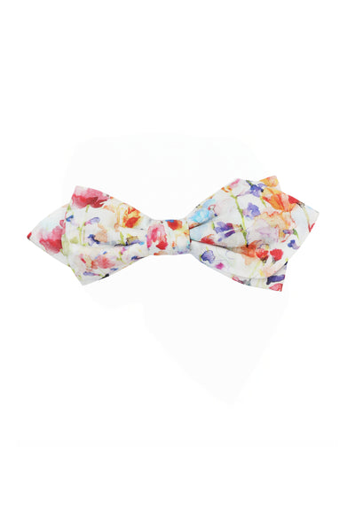 Handmade in New Zealand, the Liberty Inky Fields Bowtie by Liberty features a colorful floral watercolor pattern on white Tana Lawn cotton with splashes of red, orange, purple, and green.