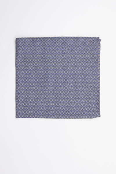 The Erin Geo Pocket Square by Barkers features a neatly folded blue design with a small, repeating circular pattern—an elegant men's formal accessory displayed on a white surface.