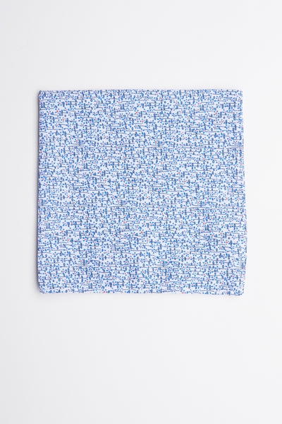 The Barkers Mildred Ditsy Flower Pocket Square features a light blue cotton fabric with small blue and red floral patterns, shown on a plain white background—a sophisticated formal accessory for any suit.