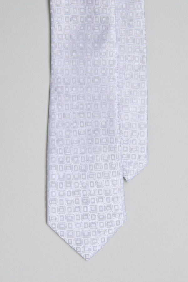 A close-up of the Barkers Royale Texture Tie in white, showcasing a subtle geometric jacquard pattern against a light gray background—an elegant option for business wear.