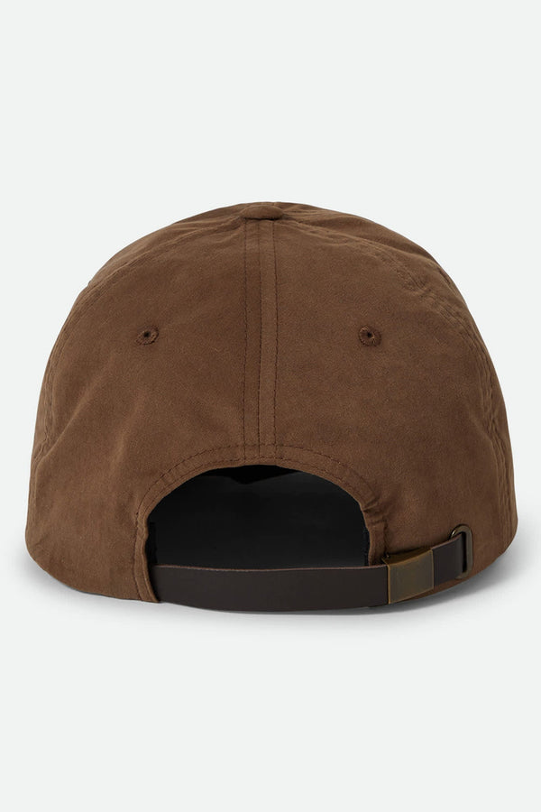 The Brixton Big B MP Cap by Brixton is a brown 6-panel baseball hat shown from the back, featuring stitched eyelets and an adjustable leather strap with metal buckle.