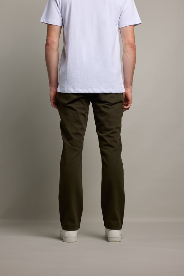 Person facing away in white shirt, white shoes, and Barkers Wanderer Straight Coloured Jean.