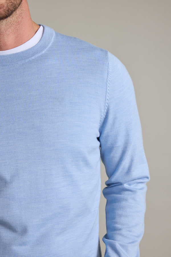 Wearing Barkers Skyland ZQrx Merino Crew in light blue over a white shirt, shoulders down.