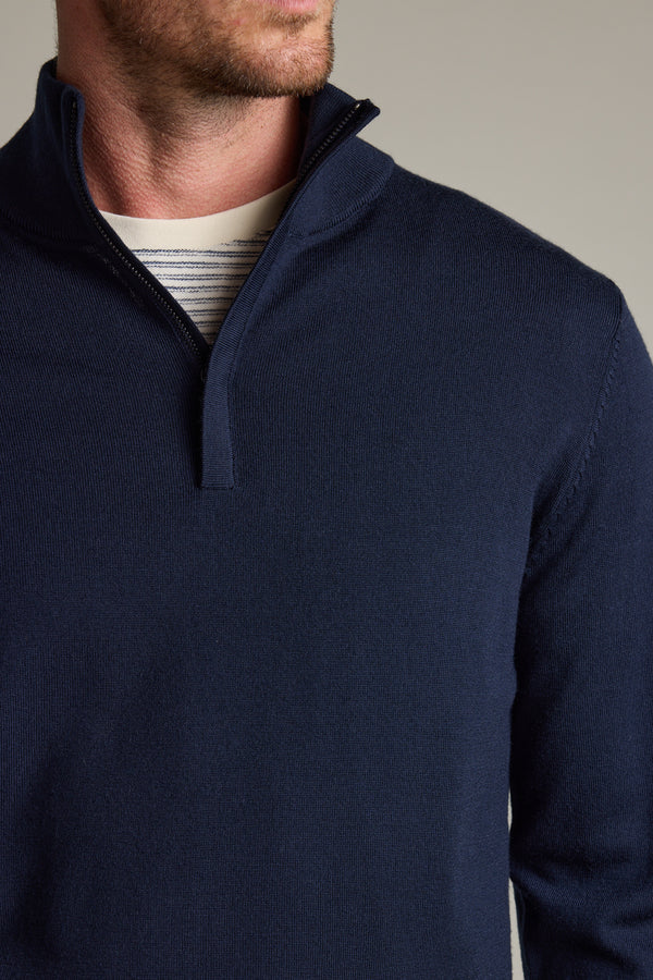 Man in Barkers Skyland ZQRX Merino 1/4 Zip over a white and grey striped shirt.