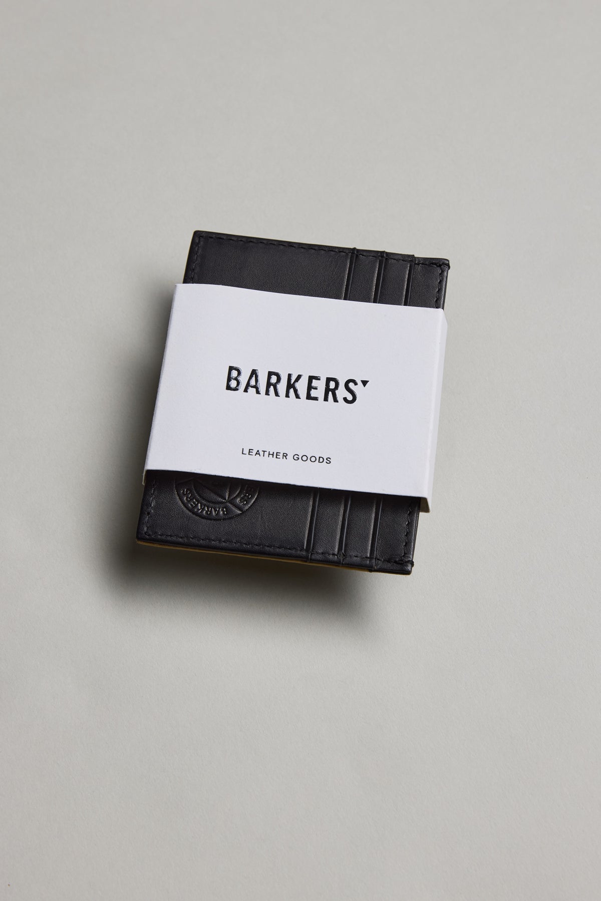 Black Taylor Leather Card Wallet by Barkers with a white band, on a light background.