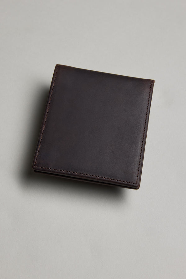 The Barkers Harris Leather Fold Wallet, a slim and neatly stitched dark brown wallet, rests on a light grey surface.