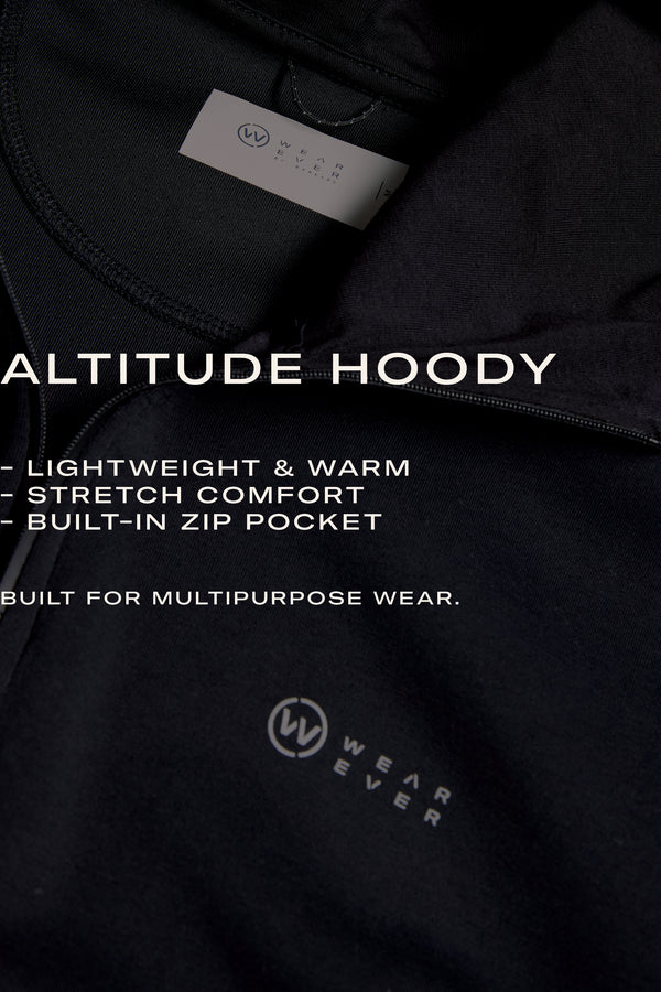 Close-up of the WearEver Altitude Hoody in black—tech fleece for lightweight warmth, stretch comfort, and a built-in zip pocket. The perfect everyday layer from WearEver, designed for versatile wear.