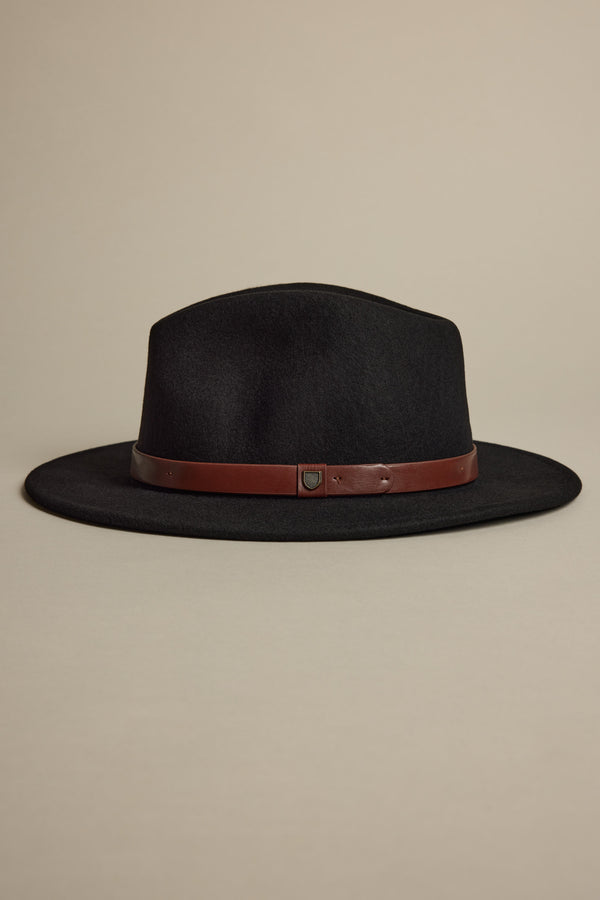 The Brixton Messer Fedora Hat by Brixton, made from premium wool felt with a wide brim and brown leather band, is shown on a neutral beige background.