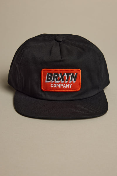 Black 5-panel Brixton Payment MP Snapback with red patch; adjustable closure.