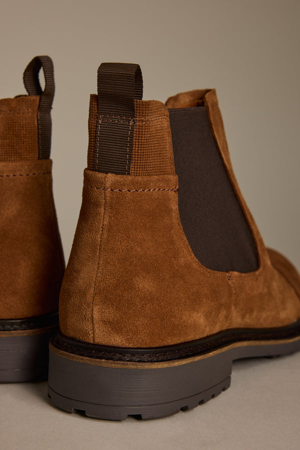 Close-up: Barkers James Chelsea Boot—brown suede, dark elastic panels, and pull tabs for men.