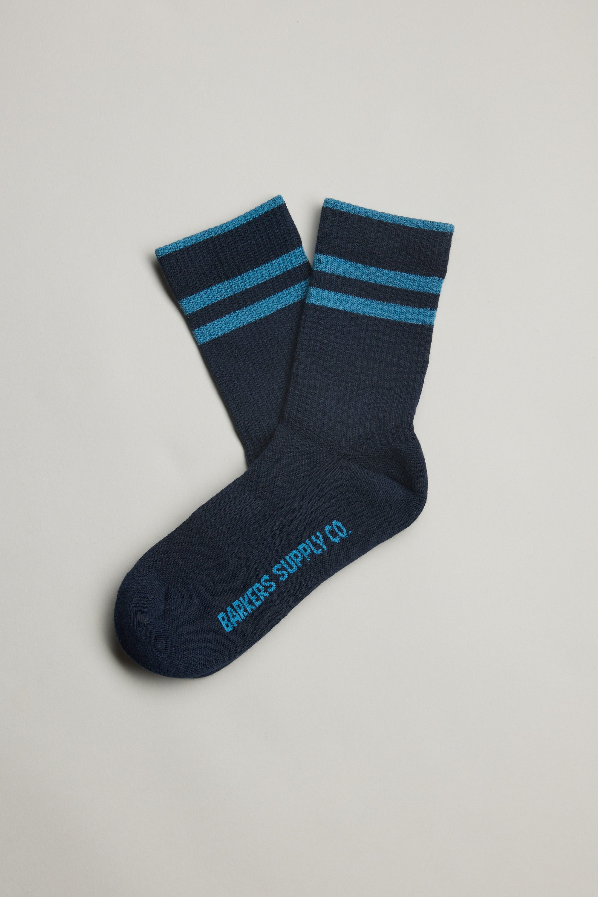 Emerson Sport Sock by Barkers: navy with blue stripes, logo on sole, shown on white background.