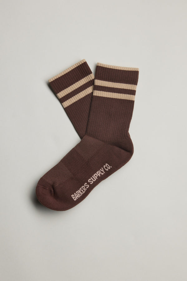 Emerson Sport Sock by Barkers in brown with beige stripes and brand text on the sole, laid flat.