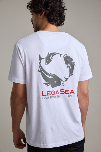Man in white Legasea Brand Tee, organic cotton, fish graphic celebrates marine life.
