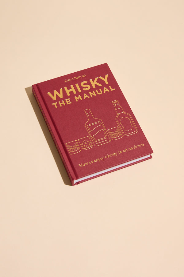 Whisky The Manual by Other—a whisky guide with tasting notes on bottles and glasses.