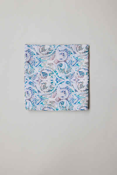 The Liberty Valerie PS by Liberty is a Tana Lawn cotton pocket square featuring an abstract floral pattern in pastel blue, purple, and pink on a light background.