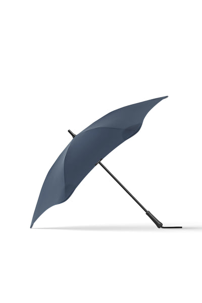 The Blunt Classic 2.0 by Blunt is a modern dark gray umbrella with a straight black handle, shown open on a white background, providing full coverage and reliable protection.