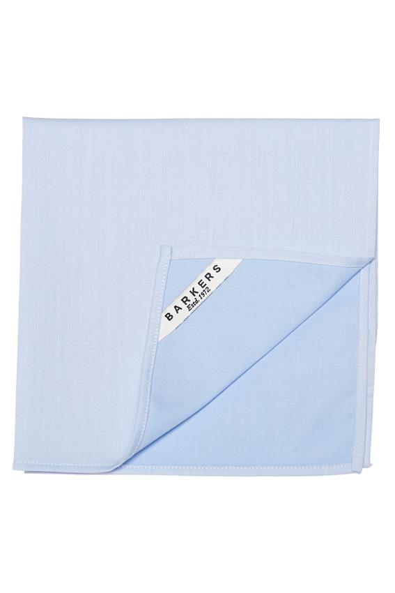 The Tribeca Pocket Square by Barkers is a light blue cotton accessory, neatly folded with one corner up to reveal a white label reading “Barkers Established 1972”—a timeless men's classic.
