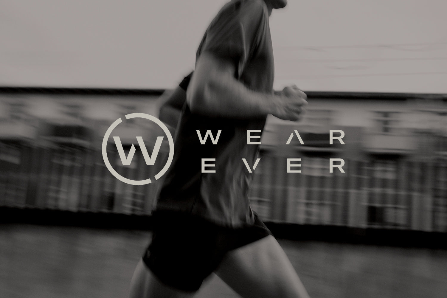 A man runs outdoors, captured in motion. The blurred background suggests speed. Overlaid text displays a circular W logo and the words WEAR EVER in modern font.