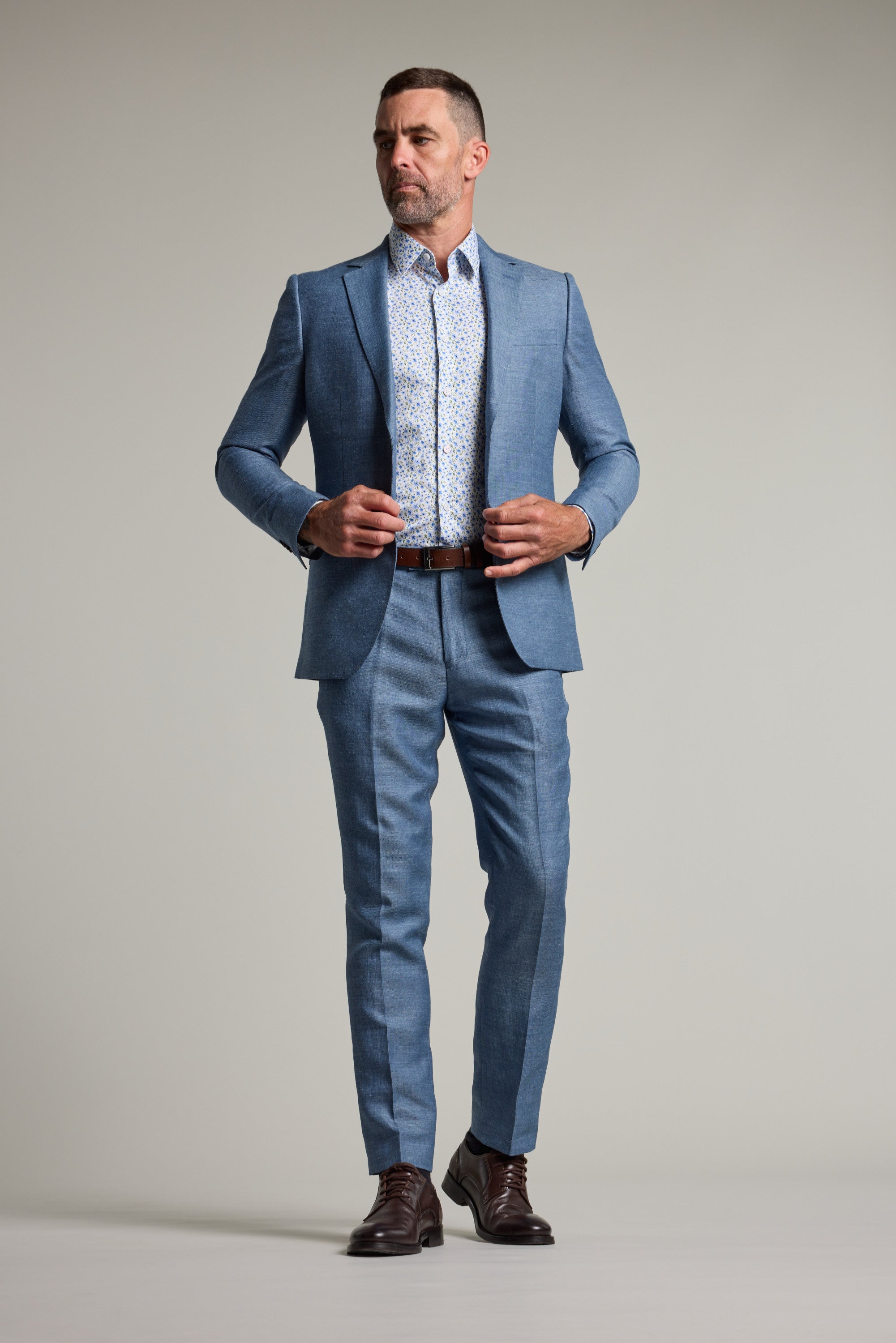 blue blazer grey trousers brown shoes