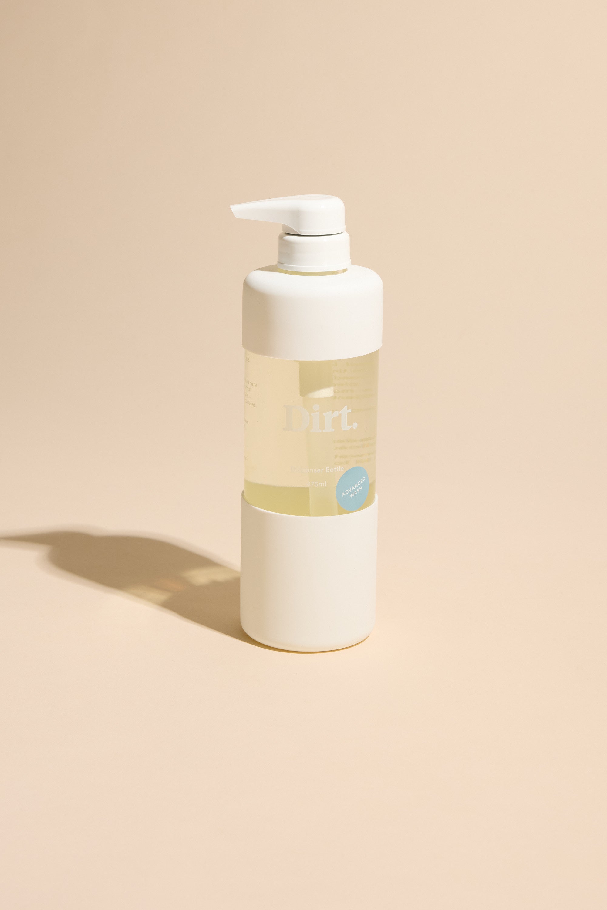 A white pump bottle labeled Other stands upright on a beige surface with a left shadow. Its minimal, modern design contains light yellow detergent for odour removal, featured in the Advanced Wash Starter Pack.