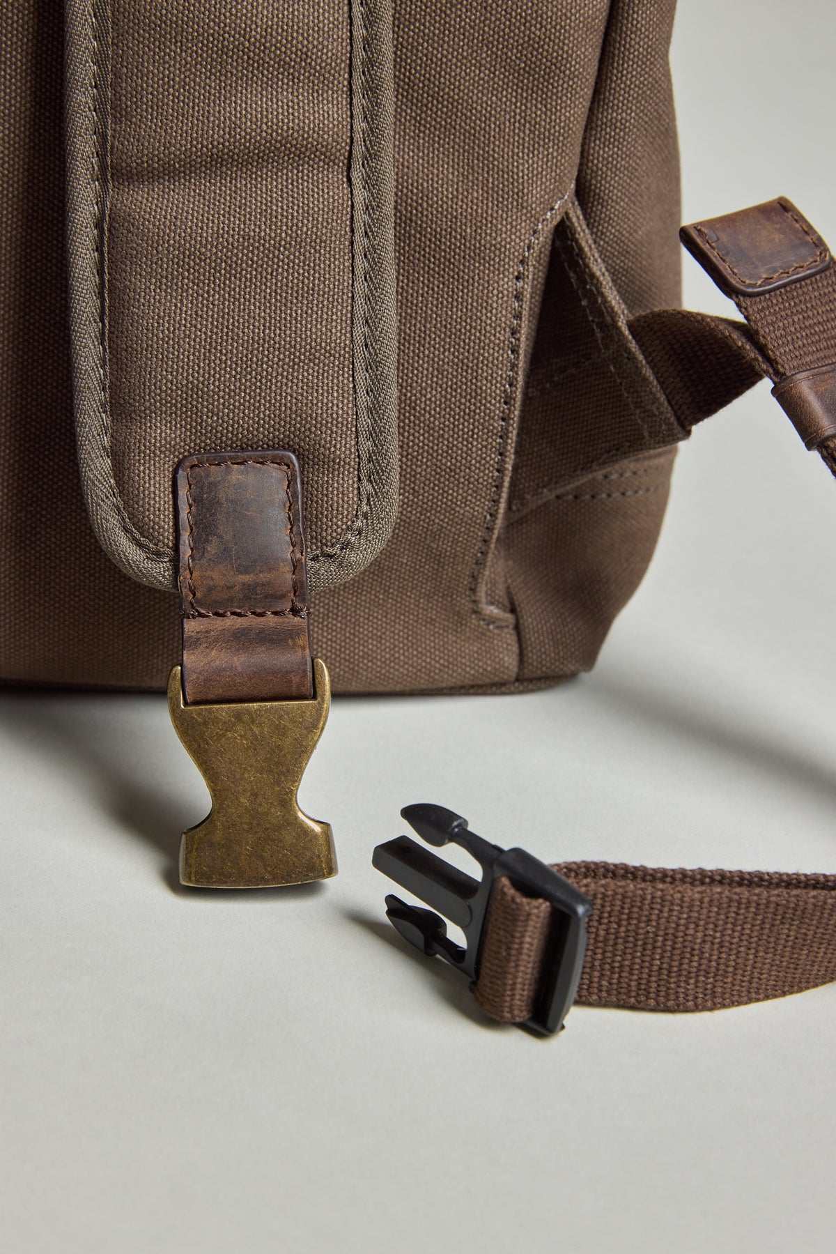 Barkers Foxton Canvas Convertible Tote with open metal/plastic buckle strap on light surface.