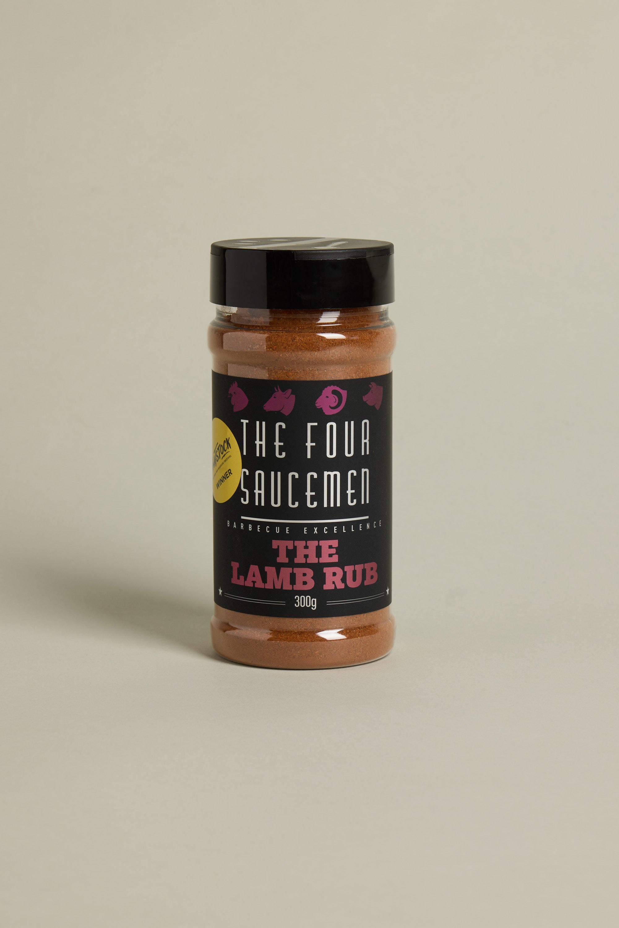 A 300g jar of Other The Lamb Rub, featuring a black lid and label with white and red text plus pink animal icons. This gluten-free BBQ seasoning is ideal for enhancing your lamb dishes.
