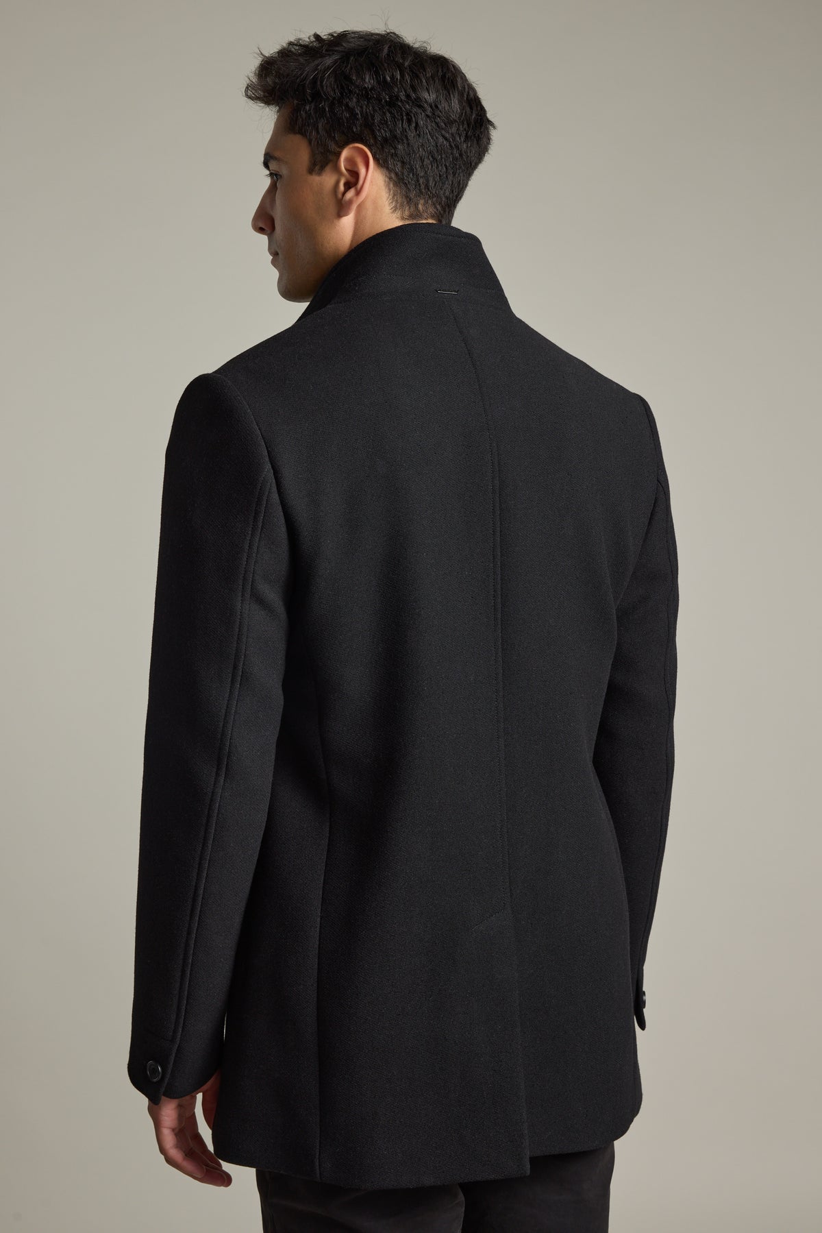 Man in Barkers Raymond Coat, back view, against plain light gray background.