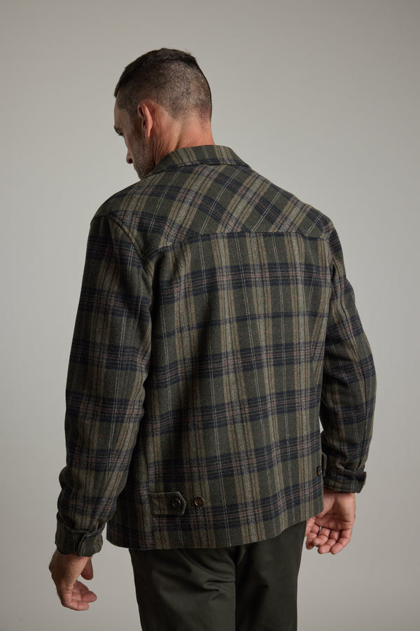 Man wearing Barkers Zermatt Wool Jacket, back turned, head facing left.