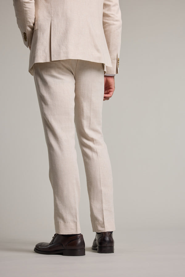 Man wearing Barkers Thompson Textured Linen Pant in beige, tapered fit, shown from the back.