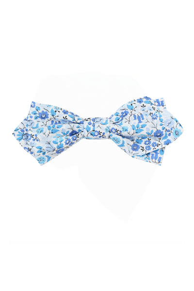 The Liberty Astrid Niva Bowtie by Liberty is handmade in New Zealand, featuring a light blue base with white and blue floral patterns.