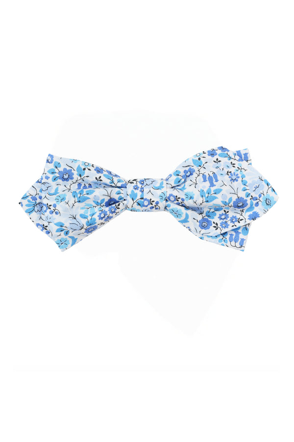 The Liberty Astrid Niva Bowtie by Liberty is handmade in New Zealand, featuring a light blue base with white and blue floral patterns.