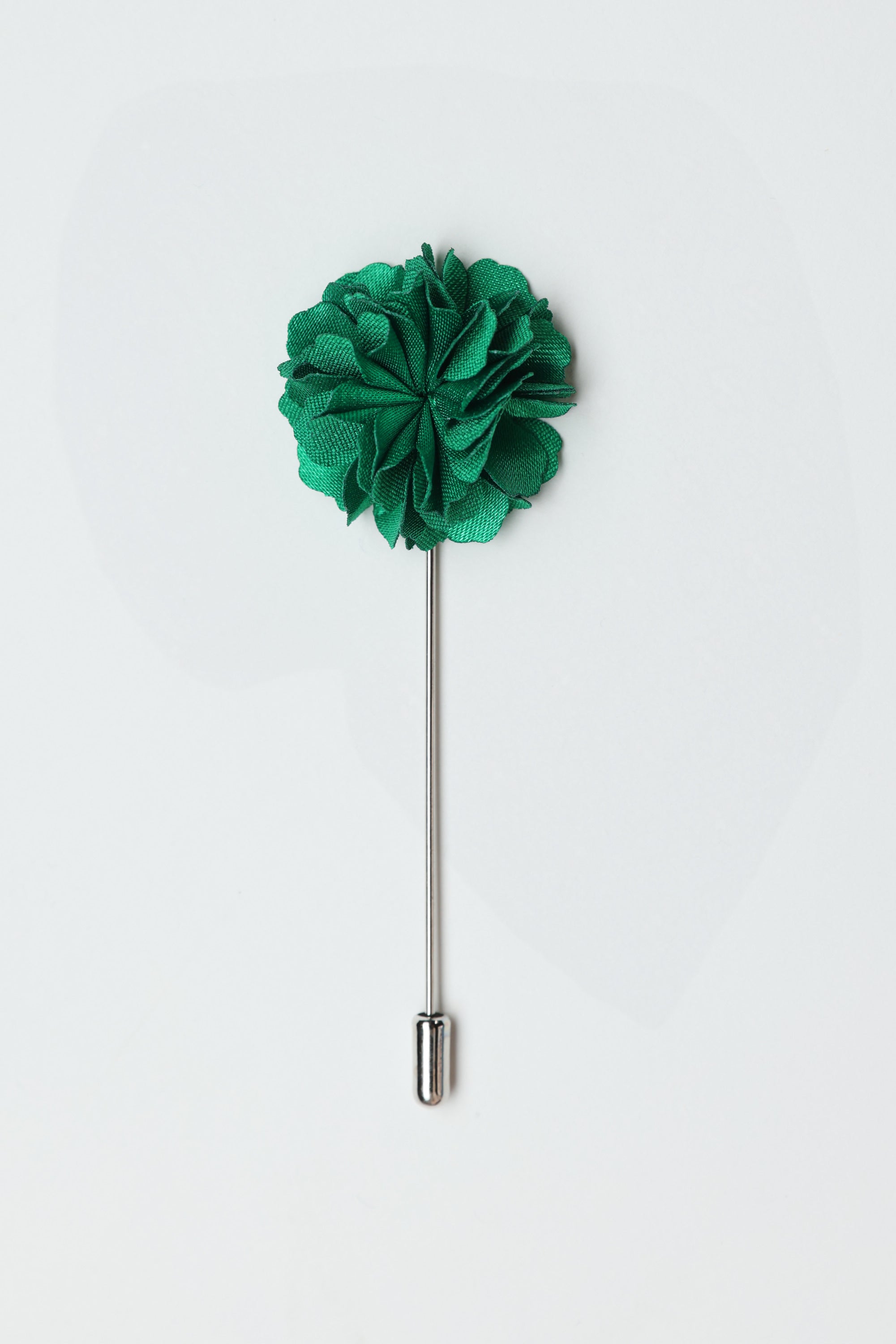 The Parisian Fraser Flower Lapel Pin features a green flower with a silver stem and cap, shown on a white background—an elegant accessory perfect for formal occasions.