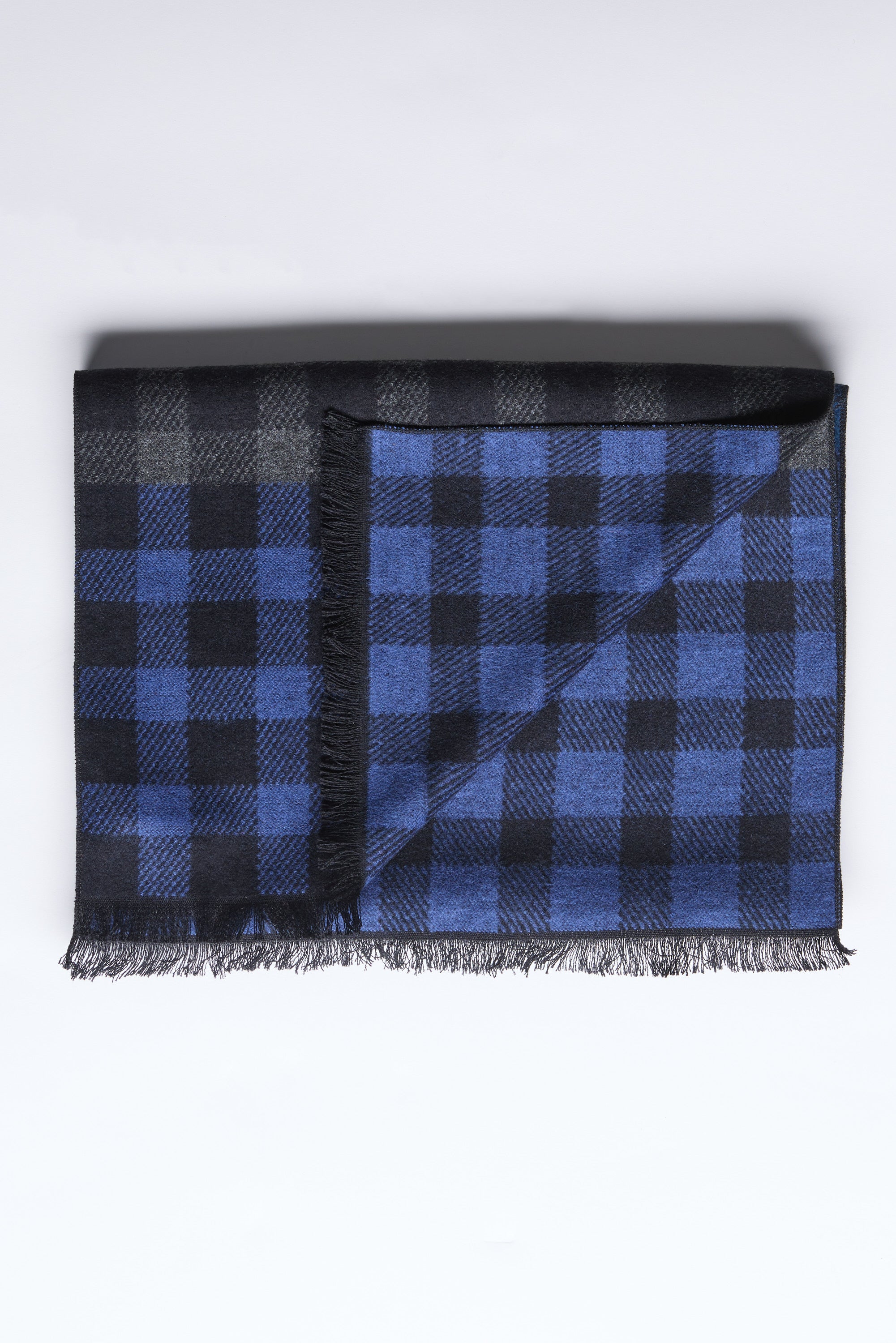 The Barkers Harper Scarf features blue & black checks, 100% rayon with fringed edges.