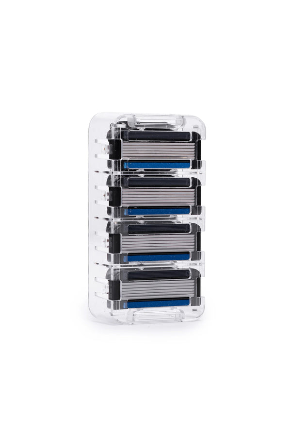 A clear plastic case holds four stacked Earnest Empire 6 blade cartridges by Other, each with black and blue accents and precision blades, set against a plain white background.