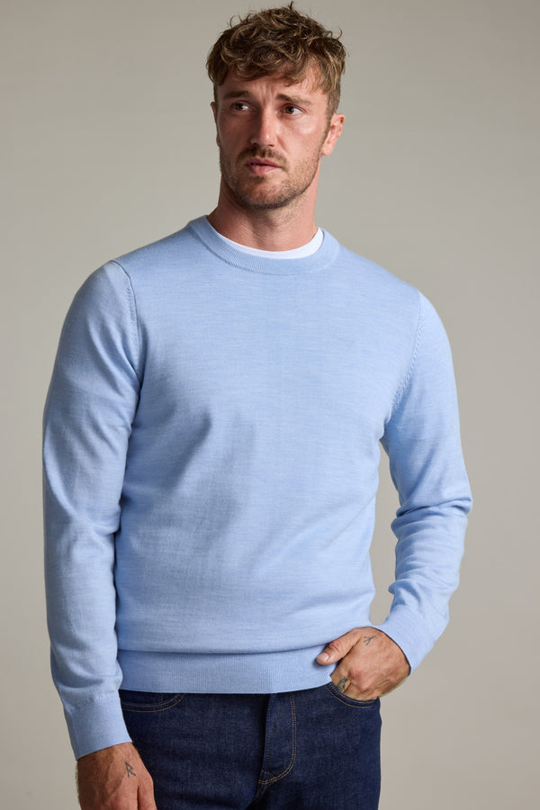 Man wears Skyland ZQrx Merino Crew by Barkers and dark jeans, sustainably sourced.