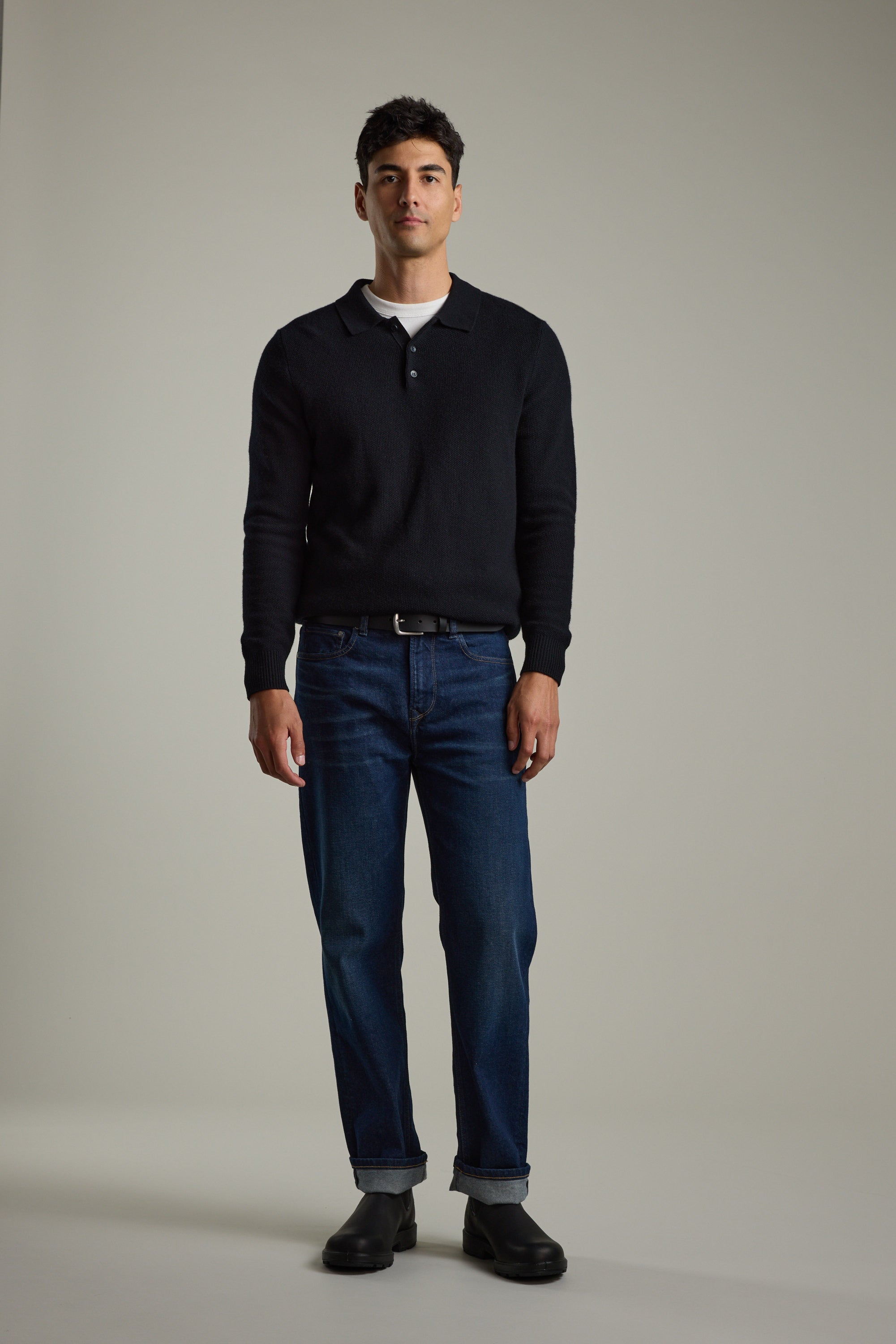 Man wearing Barkers Ainsley Woollen Long Sleeve Polo with blue jeans and black shoes.