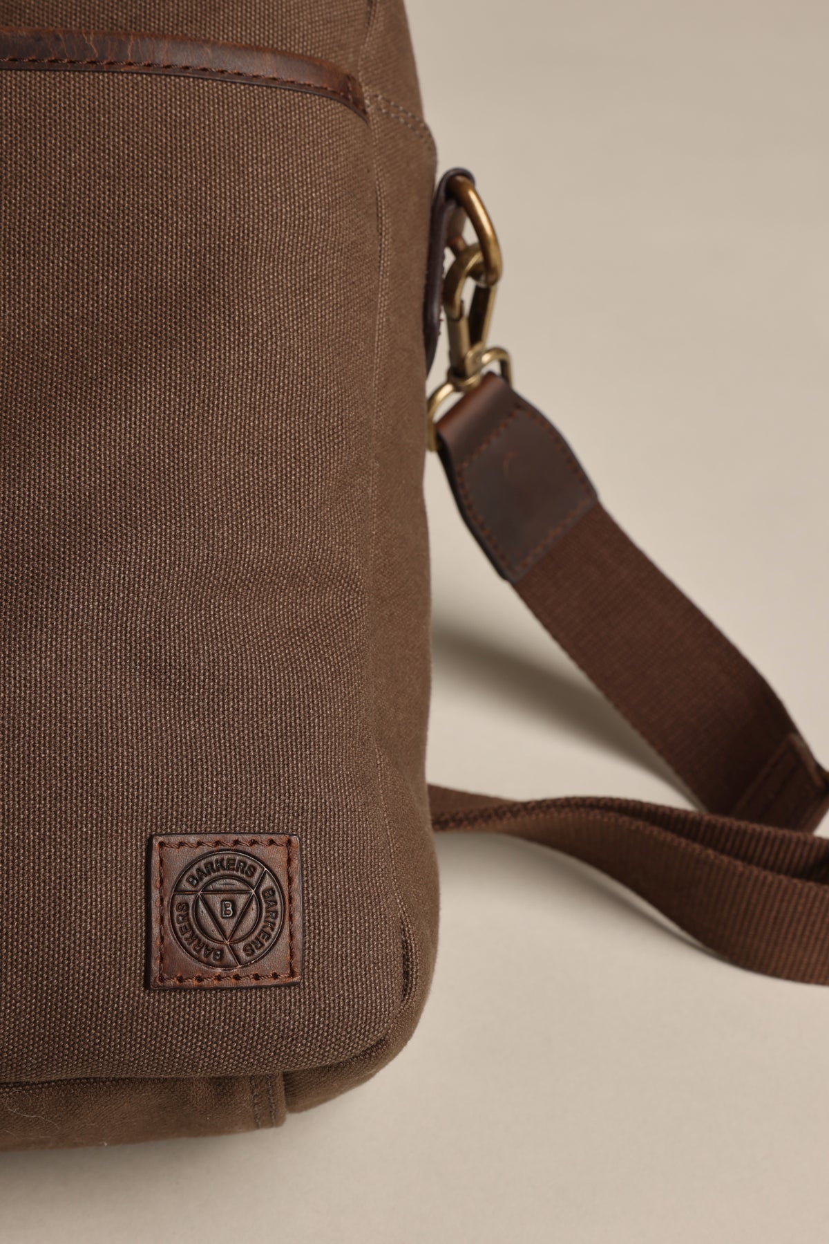 Redford Canvas Laptop Bag by Barkers: brown organic canvas, leather patch, adjustable strap.