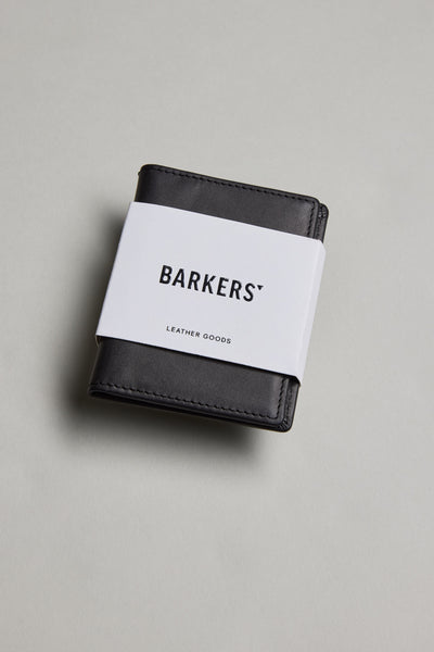 Marlin Leather Slim Wallet by Barkers, black, with white label on a light grey surface.